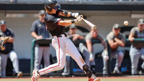 FILE - Georgia's Charlie Condon hits the ball during an NCAA regional baseball game against Army on May 31, 2024 in Athens, Ga. The Cleveland Guardians have the No. 1 overall pick in next week's draft. They have narrowed the talent pool to just a few possibilities with Oregon State second baseman Travis Bazzana, Georgia outfielder/third baseman Condon and West Virginia middle infielder Wetherholt believed to be the frontrunning options. (AP Photo/Stew Milne, File)