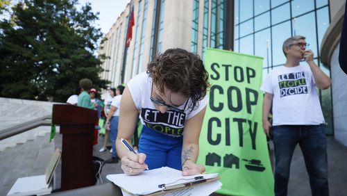 Opponents of Atlanta’s planned public safety training started gather out side of the City Hall where they will present their petition with 100,000 signatures to the city of Atlanta on Monday, Sept. 10, 2023. 
Miguel Martinez /miguel.martinezjimenez@ajc.com