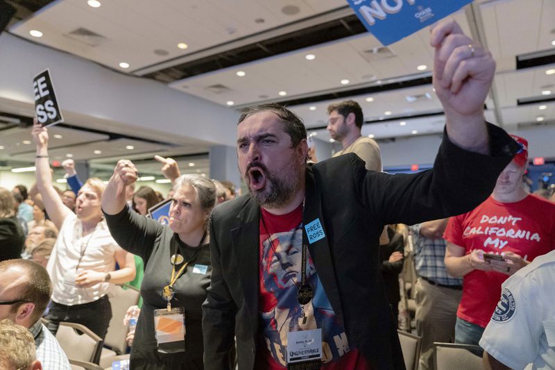 EDS NOTE: OBSCENITY - Libertarian delegates jeer Republican presidential candidate former President Donald Trump as he speaks at the Libertarian National Convention at the Washington Hilton in Washington, Saturday, May 25, 2024. (AP Photo/Jose Luis Magana)