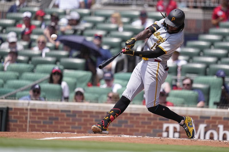 Pittsburgh Pirates' Oneil Cruz (15) hits a two-run home run in the fifth inning of a baseball game against the Atlanta Braves, Sunday, June 30, 2024, in Atlanta. (AP Photo/Brynn Anderson)