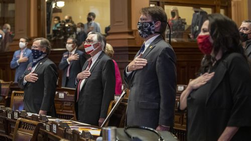 Members of the Georgia House of Representatives stand for the pledge of allegiance during the first day of the 2021 legislative session at the Georgia State Capitol building in downtown Atlanta, Monday, January 11, 2021. (Alyssa Pointer / Alyssa.Pointer@ajc.com)