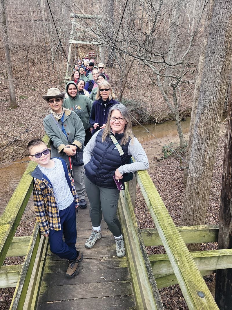 Nature centers offer a variety of programs for adults as well as children such as this healthy-sized group hiking at Elachee Nature Science Center in Gainesville. 
(Courtesy of Elachee Nature Science Center)