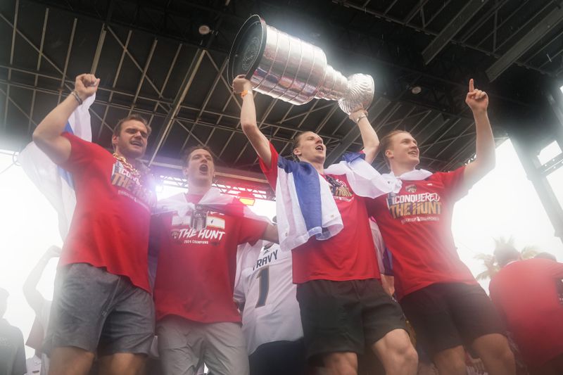 The Florida Panthers team celebrates their Stanley Cup victory over the Edmonton Oilers with an NHL hockey parade and rally Sunday, June 30, 2024, in Fort Lauderdale, Fla. (AP Photo/Marta Lavandier)
