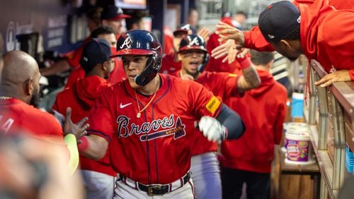 Atlanta Braves third baseman Gio Urshela (9) celebrates after hitting a homer in the second inning against the Los Angeles Dodgers at Truist Park in Atlanta on Friday, September 13, 2024. The Braves won 6-2. (Arvin Temkar / AJC)