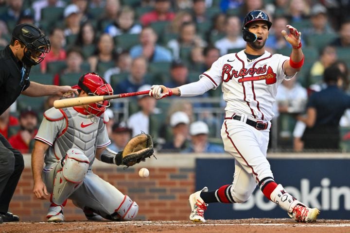 Atlanta Braves left fielder Eddie Rosario (8) swings and misses against the Philadelphia Phillies during the second inning of the NLDS Game 2 In Atlanta on Monday, Oct. 9, 2023.   (Hyosub Shin / Hyosub.Shin@ajc.com)