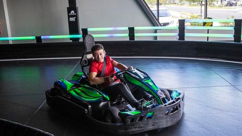 Mario Andretti's son-in-law Giuseppe Curto takes a go-kart for a spin while on a tour of the karting track during the grand opening at the Andretti Indoor Karting & Games in Buford Wednesday, June 23, 2021. (Alyssa Pointer / Alyssa.Pointer@ajc.com)