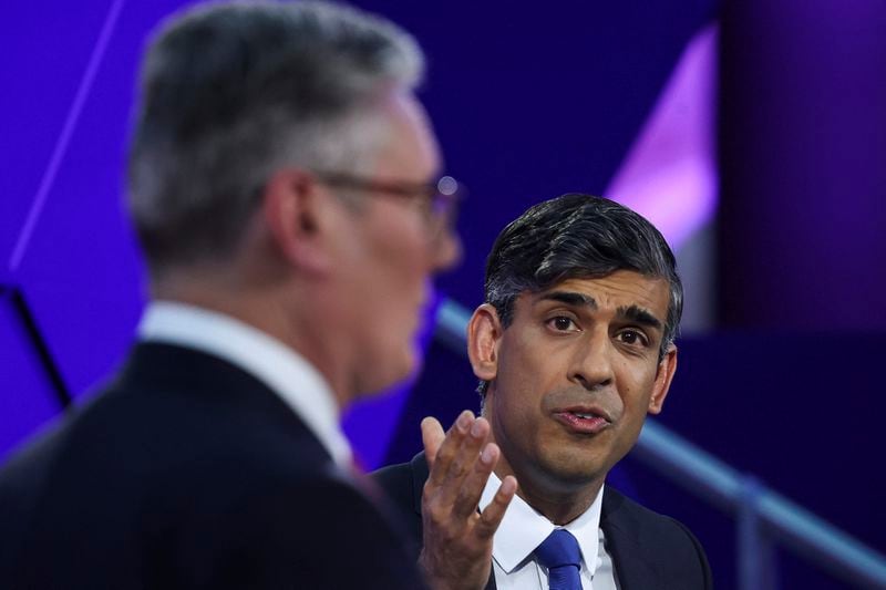 Britain's Prime Minister Rishi Sunak and opposition Labour Party leader Keir Starmer, left, take part for the BBC's Prime Ministerial Debate, in Nottingham, England, Wednesday June 26, 2024. (Phil Noble/Pool via AP)
