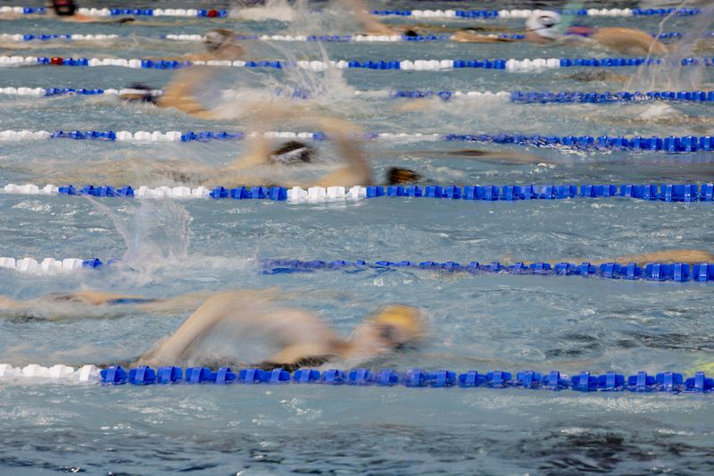 
                        FILE — Warmups before the 2022 NCAA Division I Women's Swimming and Diving Championships at Georgia Tech University, in Atlanta, Ga. on March, 19, 2022. The Biden administration proposed a rule change that would allow schools to block some transgender athletes from competing on sports teams that match their gender identities. (David Walter Banks/The New York Times)
                      