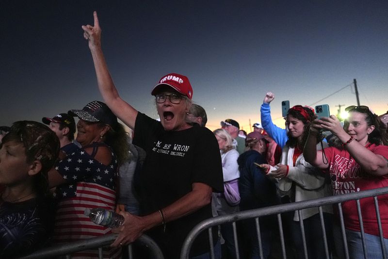 Supporters cheer after a campaign rally with Republican presidential nominee former President Donald Trump at the Butler Farm Show, Saturday, Oct. 5, 2024, in Butler, Pa. (AP Photo/Julia Demaree Nikhinson)