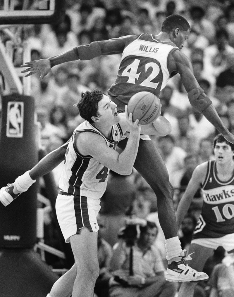 Kevin Willis of the Hawks fouls Bill Laimbeer during a playoff game in 1987. Rich Addicks / AJC file photo