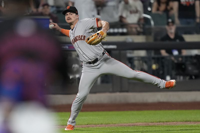 San Francisco Giants' Matt Chapman throws out New York Mets' Mark Vientos at first base for the final out of the baseball game, Friday, May 24, 2024, in New York. (AP Photo/Frank Franklin II)