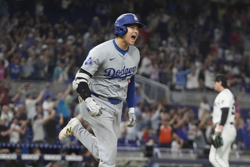 Los Angeles Dodgers' Shohei Ohtani (17) reacts after hitting his 50th home run of the season during the seventh inning of a baseball game against the Miami Marlins, Thursday, Sept. 19, 2024, in Miami. (AP Photo/Marta Lavandier)