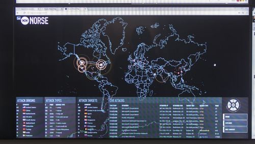 The Norse Attack Map shows the locations of targets and attackers for online attacks worldwide. (CASEY SYKES, CASEY.SYKES@AJC.COM)