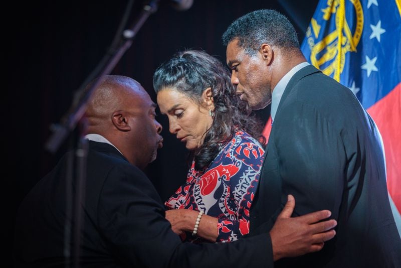 Republican candidate Herschel Walker leaves the stage at his U.S. Senate runoff election night party Dec. 6 at the College Football Hall of Fame in Atlanta. Walker lost to Democratic U.S. Sen. Raphael Warnock. (Arvin Temkar / arvin.temkar@ajc.com)