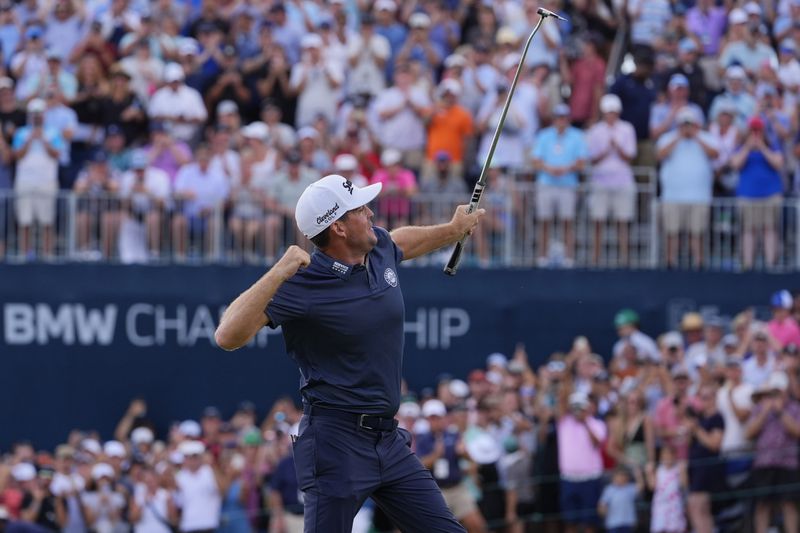 Keegan Bradley celebrates on the 18th green after winning the BMW Championship golf event at Castle Pines Golf Club, Sunday, Aug. 25, 2024, in Castle Rock, Colo. (AP Photo/Matt York)