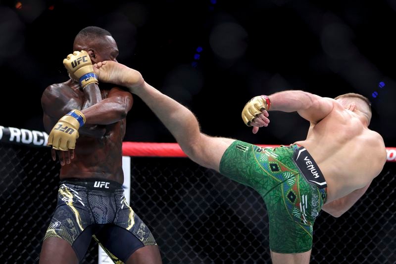 Dricus du Plessis, right, of South Africa and Israel Adesanya of Nigeria fight during their Middleweight title bout at UFC 305 at RAC Arena in Perth, AUstralia Sunday, Aug. 18, 2024. (Richard Wainwright/AAP Image via AP)