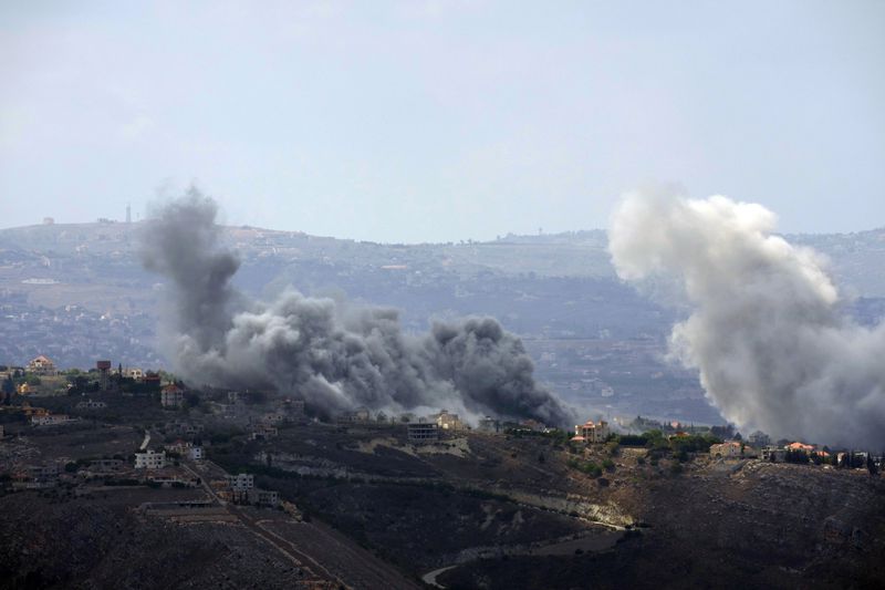 Smoke rises from Israeli airstrikes on Taybeh village, seen from the southern town of Marjayoun, Lebanon, Monday, Sept. 23, 2024. (AP Photo/Hussein Malla)