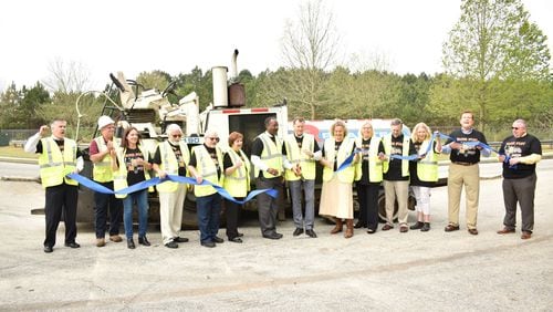 City and county officials attended a ribbon-cutting for the new round of road work.