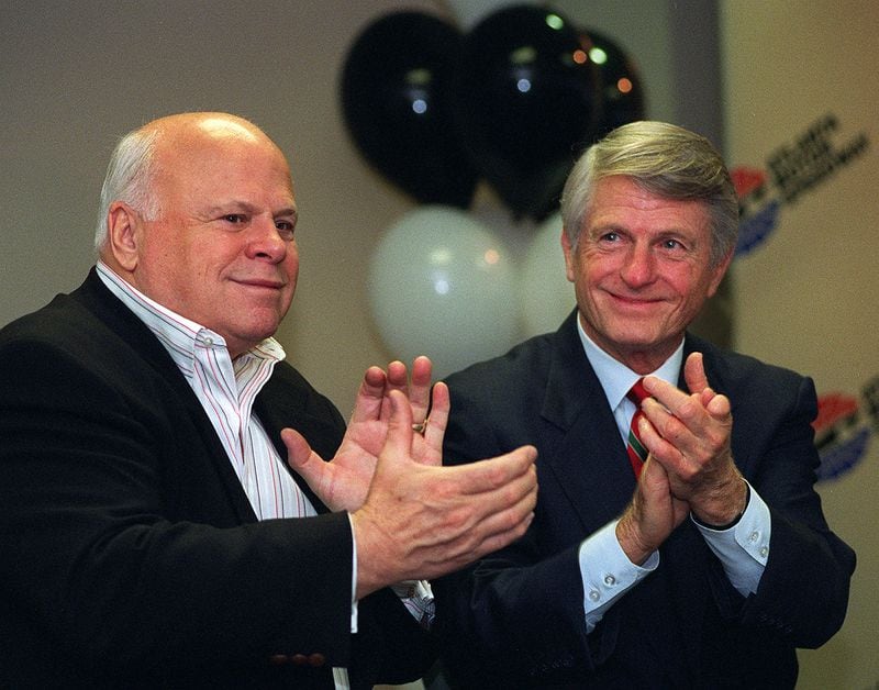 Bruton Smith (left), owner of Atlanta Motor Speedway, and Georgia Governor Zell Miller clap their hands at a ceremony at AMS in 1997. (AJC file photo / Johnny Crawford)
