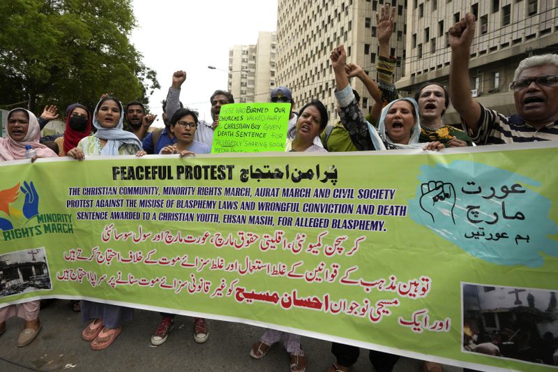 Members from Pakistan's minority community and civil society chant slogans during a demonstration against the conviction of a Christian man on charges of blasphemy and condemn the country's blasphemy laws, Tuesday, July 2, 2024. A court had awarded a death sentence to Ehsan Shan after finding him guilty of sharing "hateful content against Muslims on social media after one of the worst mob attacks on Christians in the eastern Punjab province last year. (AP Photo/Fareed Khan)