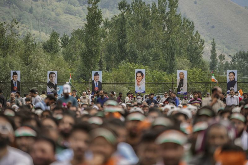 Supporters listen as India's opposition Congress party leader Rahul Gandhi, unseen, speaks during an election rally at Dooru some 78 kilometers south of Srinagar, Indian controlled Kashmir, Wednesday, Sept. 4, 2024. (AP Photo/Mukhtar Khan, FILE)