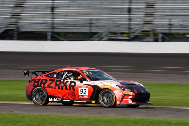 Keanu Reeves drives during the GR Cup Series auto race at Indianapolis Motor Speedway, Saturday, Oct. 5, 2024, in Indianapolis. (AP Photo/Darron Cummings)