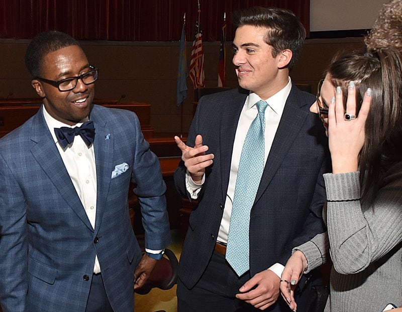 North Atlanta High School students Nicolas Delporte and Katherine Waken, who are both considering legal careers, celebrate with Clyde Mize after his swearing-in as president of the Gate City Bar Association. Both attended law firm Morris, Manning & Martin’s summer program to get diverse students interested in legal careers. CONTRIBUTED BY DON MORGAN PHOTOGRAPHY