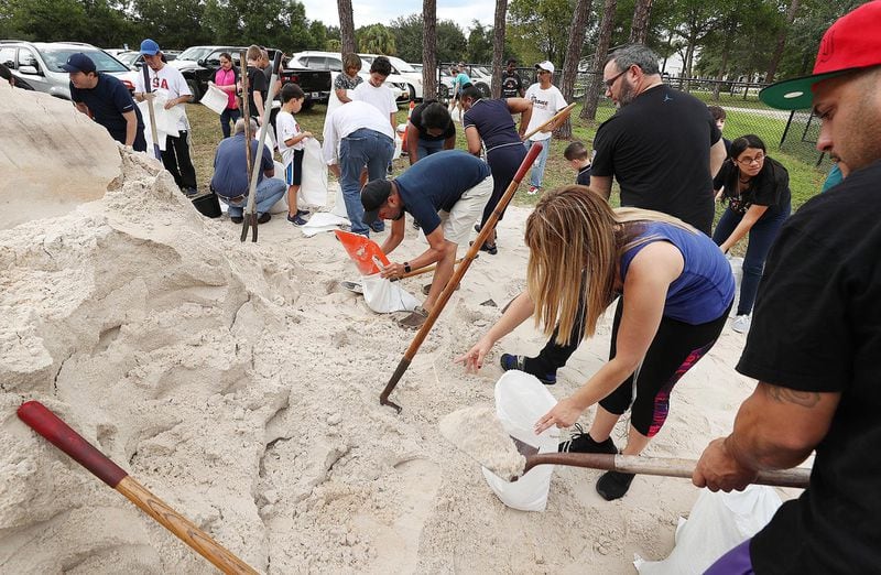 Dozens of Orange County residents fill sandbags at Blanchard Park in Orlando, Fla., on Wednesday, Aug. 28, 2019. The sandbags are being offered in advance of Hurricane Dorian, which is forecast to likely hit Florida. 