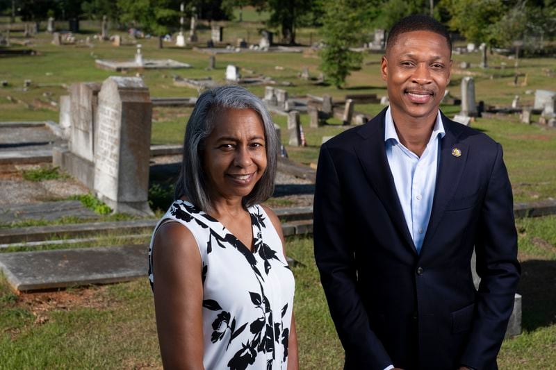 Winifred “Wini” Watts Hemphill, president of the South-View Cemetery Association and Atlanta Councilmember Jason Winston stand in the original section of the cemetery Friday, June 21, 2024. Winston secured funding for the cemetery, chartered in 1886 by formerly enslaved people, to apply to the National Register of Historic Places. (Ben Gray / Ben@BenGray.com)