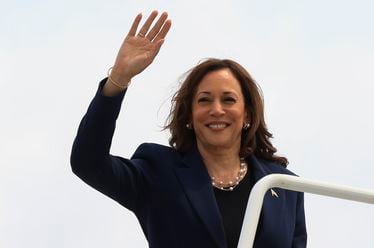 Vice President Kamala Harris waves as she boards Air Force Two following a campaign event, in Milwaukee, Wis., Tuesday, July 23, 2024. (Kevin Mohatt/Pool via AP)