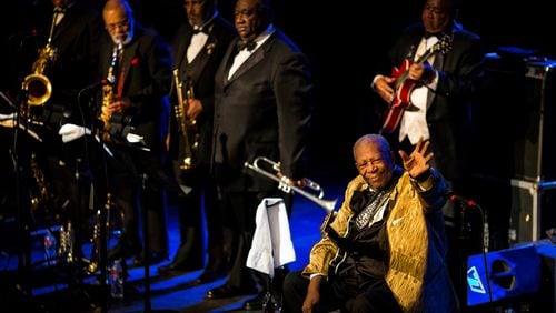 In this photo taken on Monday, March 3, 2014, Blues legend B.B. King performs for hundreds at The Moore Theatre in Seattle. King, whose scorching guitar licks and heartfelt vocals made him the idol of generations of musicians and fans while earning him the nickname King of the Blues, died late Thursday, May 14, 2015, at home in Las Vegas. He as 89. ( Jordan Stead/seattlepi.com via AP)