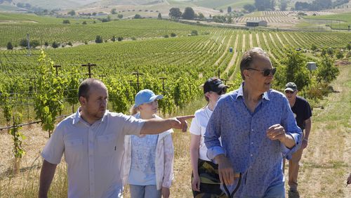 Ukrainian winemaker Georgiy Molchanov, left, asks a question to Ivo Jeramaz, right, during a tour of a Grgich Hills Estate's vineyard Wednesday, June 5, 2024, in American Canyon, Calif. (AP Photo/Godofredo A. Vásquez)