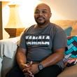 Randall Eichelberger, a flight attendant and resident of Clayton, poses for a portrait at his home on Sept. 30, 2024. As a voter, Eichelberger says abortion is his top priority in this election. Additionally, he is concerned about the economy, citing rising costs that forced him to sell his car due to unaffordable insurance rates. (Olivia Bowdoin for the AJC).