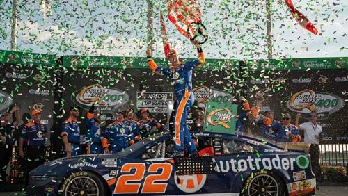 NASCAR Cup Series driver Joey Logano celebrates after winning the Quaker State 400 at Atlanta Motor Speedway, Sunday, Sept. 8, 2024, in Hampton. (Hyosub Shin / AJC)