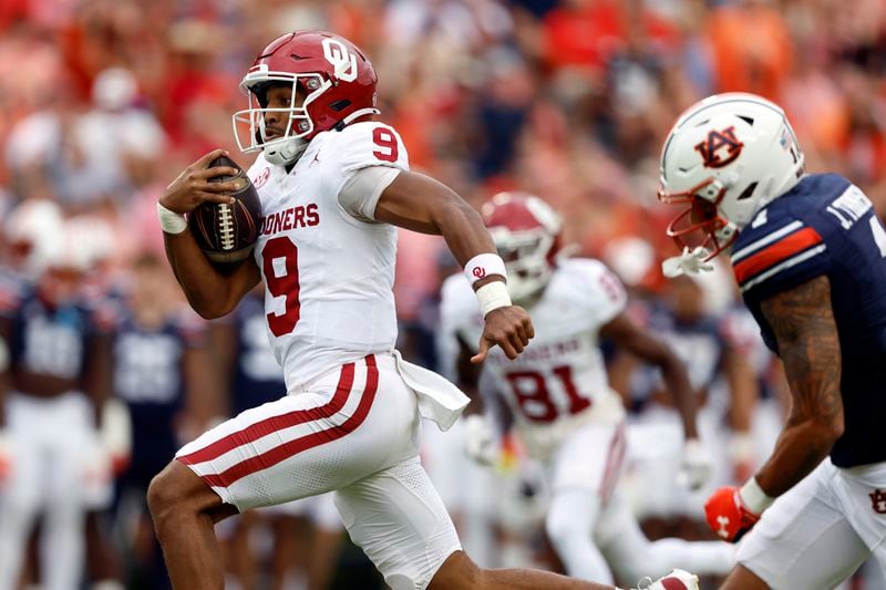 Oklahoma quarterback Michael Hawkins Jr. (9) breaks free for a touchdown against Auburn during the first half of an NCAA college football game, Saturday, Sept. 28, 2024, in Auburn, Ala. (AP Photo/Butch Dill)