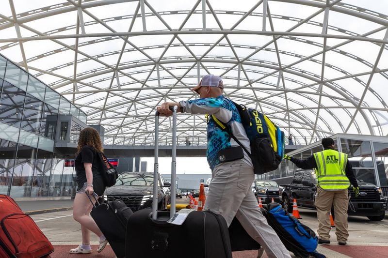 Travelers are seen in the domestic terminal of Hartsfield-Jackson airport in Atlanta on Friday, June 30, 2023. (Arvin Temkar / arvin.temkar@ajc.com)