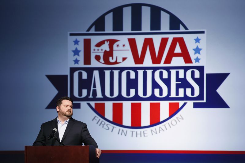 Troy Price, the former Iowa Democratic Party chairman who oversaw the 2020 caucuses, speaks about the election on  Feb. 4, 2020, in Des Moines, Iowa. Under a reported proposal by President Biden about Democratic primaries, Iowa would lose its "first in the nation" status. (Charlie Neibergall/AP)