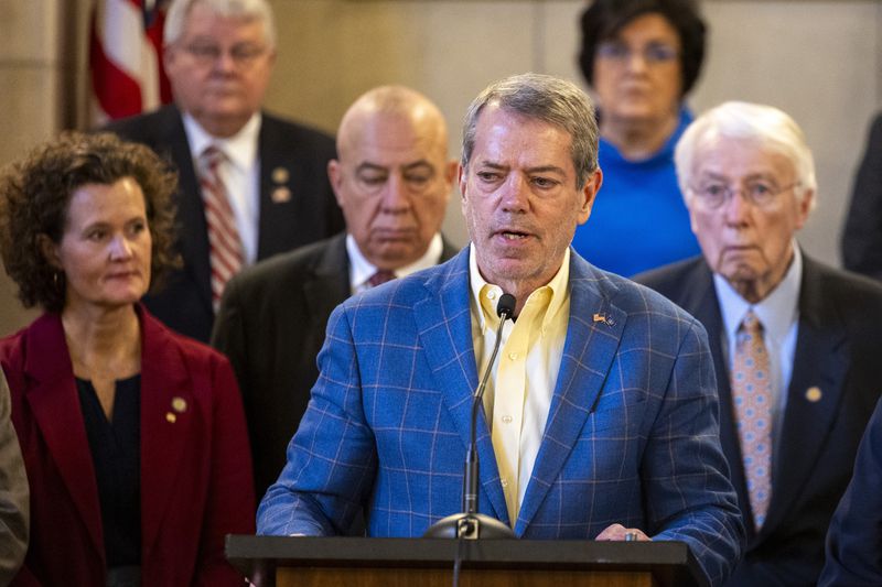 FILE - Gov. Jim Pillen is joined by state senators as he announces that the state will participate in the Summer Electronic Benefits Transfer Program after previously saying Nebraska wouldn't take part during a press conference in the Warner Chamber at the Capitol, Monday, Feb. 12, 2024, in Lincoln, Neb. (Kenneth Ferriera/Lincoln Journal Star via AP, File)