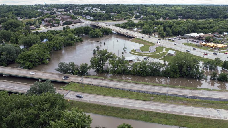 Rotary Park, planted right in the middle, is underwater on Saturday, June 22, 2024, in Sioux Falls, S.D., after days of heavy rain led to flooding in the area. (AP Photo/Josh Jurgens)