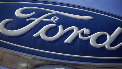 FILE - A Ford company logo on a sign at a Ford dealership in southeast Denver, Oct. 24, 2021. (AP Photo/David Zalubowski, File)