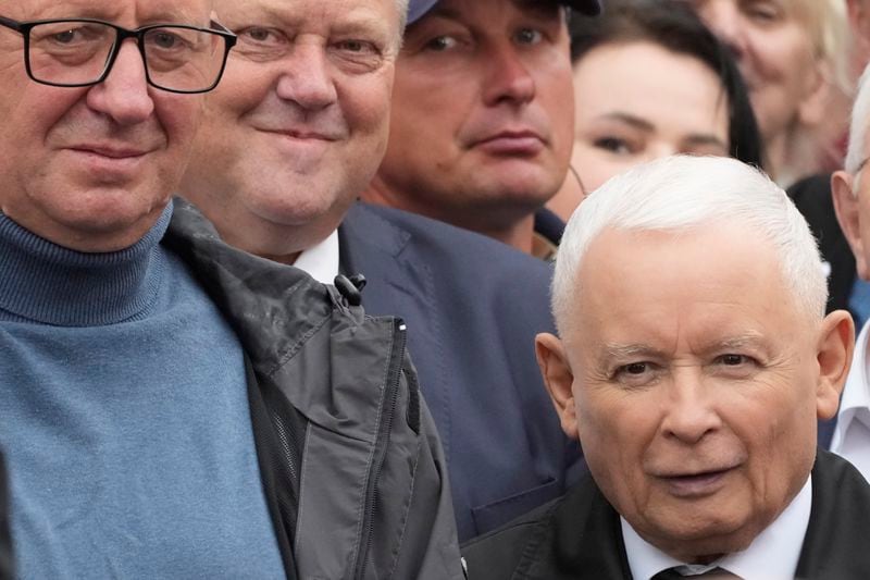 Leader of Poland's right-wing opposition party Law and Justice, Jaroslaw Kaczynski, right, attends the party's protest rally of a few thousand backers against the policies of Prime Minister Donald Tusk's Cabinet before the Ministry of Justice, in Warsaw, Poland, Saturday Sept. 14, 2024. (AP Photo/Czarek Sokolowski)