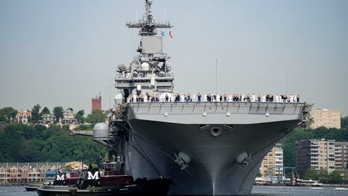 FILE - Sailors and military service personnel arrive on the USS Wasp amphibious assault ship on the Hudson River during fleet week, May 24, 2023, in New York. (AP Photo/John Minchillo, FIle)