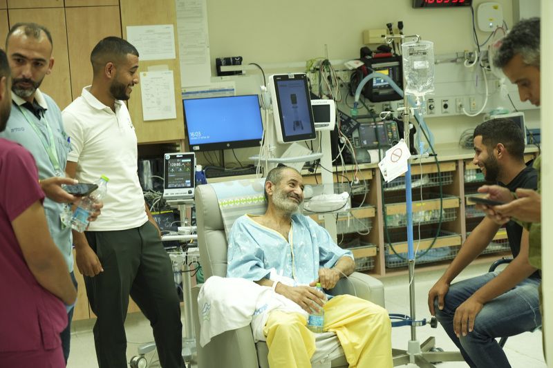 In this photo released by the Israel Prime Minister Office on Tuesday, Aug. 27, 2024, Kaid Farhan Al-Qadi, 52, who was held hostage by Hamas militants in Gaza sits in a room at the Soroka Medical Center in Beersheba, Israel. (Israel Prime Minister Office via AP)