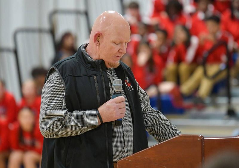 Coach Jay Wilson of Veterans Memorial Middle School in Columbus, Georgia greets guests, family and dignitaries for the dedication ceremony naming the school gymnasium’s court in his honor. (Photo Courtesy of Darrell Roaden)