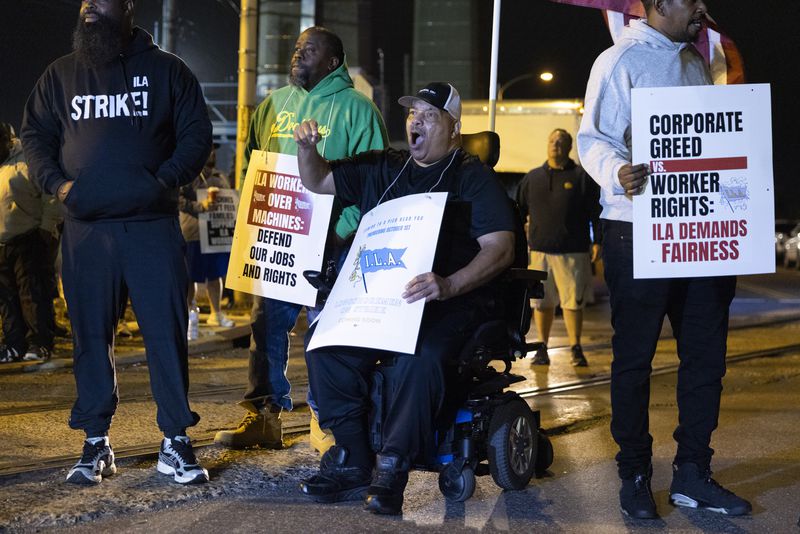 Boise Butler, president of Local 1291, chants along with his fellow longshoremen outside the Packer Avenue Marine Terminal Port in Philadelphia, Tuesday, Oct. 1, 2024. (AP Photo/Ryan Collerd)