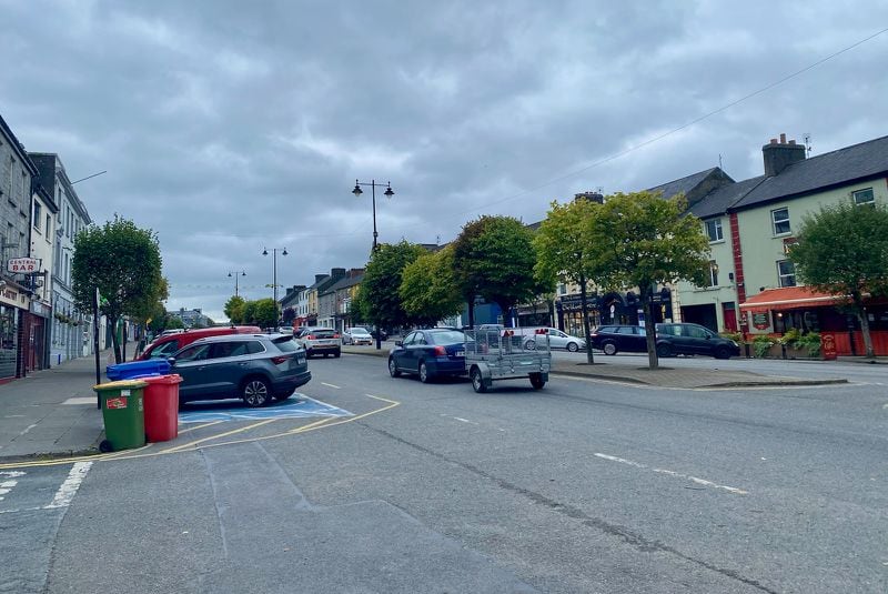 A view of Main Street in Castleisland, Ireland, which I visited Wednesday to meet the parents of Georgia Tech punter David Shanahan as well as two friends and two former coaches. Castleisland is a town of about 2,500. This street is exceptionally wide, according to storiedkerry.com, and has its width because a row of houses in the middle of the street were demolished, leaving one wide street instead of two narrower ones.
Interesting fact shared by Shanahan's father Jack. There used to be 52 pubs in Castleisland, but now because of people's changing habits there are only eight or nine. I have to say that still seems like a pretty high per-capita rate. (AJC photo by Ken Sugiura)