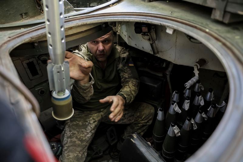 In this photo provided by Ukraine's 24th Mechanised Brigade press service, servicemen of 24th mechanised brigade prepare to fire BRM1k infantry fighting vehicle towards Russian positions near Chasiv Yar town, in Donetsk region, Ukraine, Aug. Saturday 17, 2024. (Oleg Petrasiuk/Ukrainian 24th Mechanised Brigade via AP)