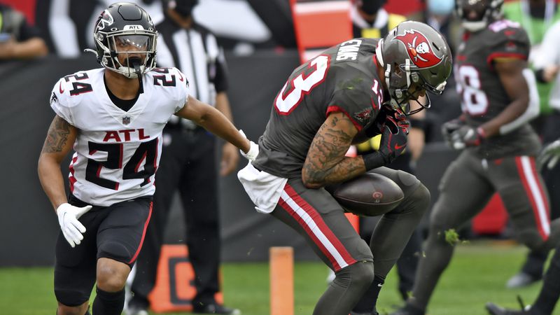Tampa Bay Buccaneers wide receiver Mike Evans (13) can't hang onto the ball after getting around Atlanta Falcons cornerback A.J. Terrell (24) in the end zone during the first half Sunday, Jan. 3, 2021, in Tampa, Fla. Evans injured his knee on the play and left the game. (Jason Behnken/AP)