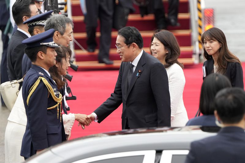 Japanese Prime Minister Fumio Kishida, center left, is greeted as his wife Yuko Kishida stands upon their arrival at Seoul airbase in Seongnam, South Korea, Friday, Sept. 6, 2024. (AP Photo/Ahn Young-joon)