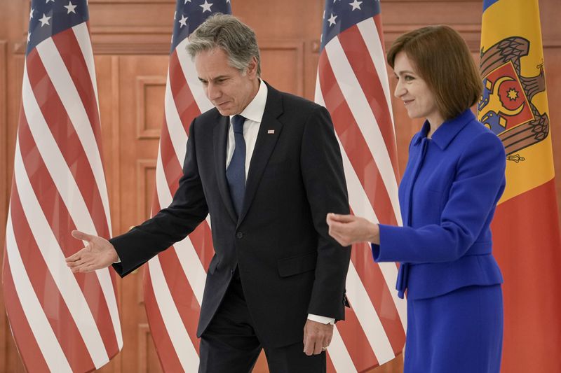 US Secretary of State Antony Blinken, left, walks with Moldova's President Maia Sandu at the Presidential Palace in Chisinau, Moldova, Wednesday, May 29, 2024. (AP Photo/Vadim Ghirda, Pool)